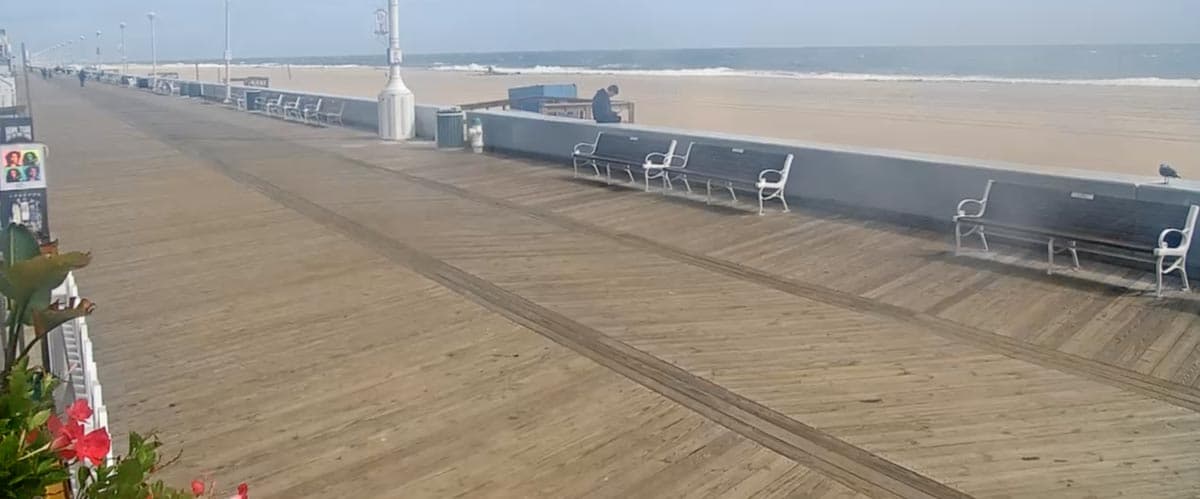 Ocean City boardwalk with rides and Ferris wheel